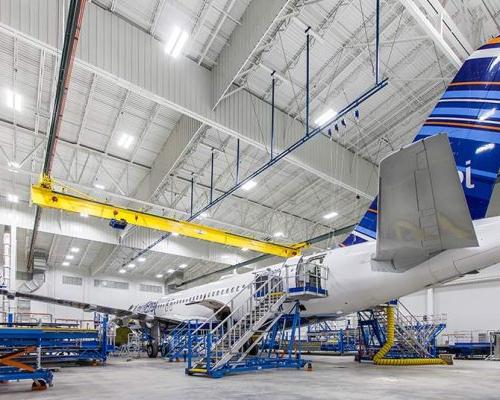 Airplane sitting inside Lufthansa Technik Heavy Maintenance Facility.