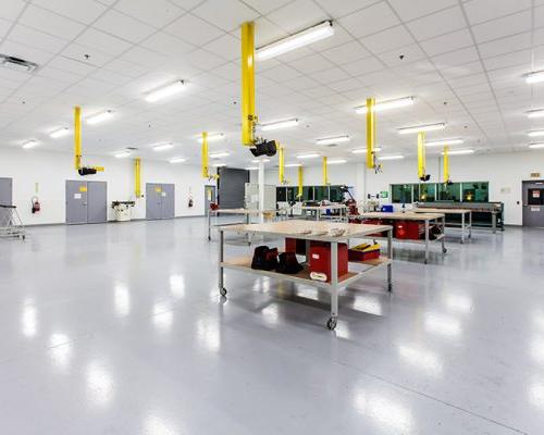 Large, bright room at Lufthansa Technik Heavy Maintenance Facility with several rollable tables.